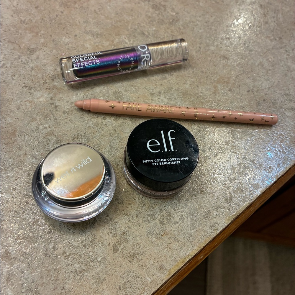 4 pc lot of 2 multichrome eyeshadow, 1 eye brightener &
1 fake awake eye pencil